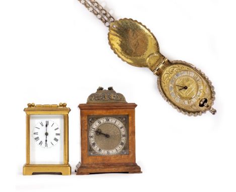 A SILVER ELIZABETHAN STYLE SHELL MOULDED LOCKET WATCH with suspension chain, 2.5cm wide together with a walnut cased mantle t
