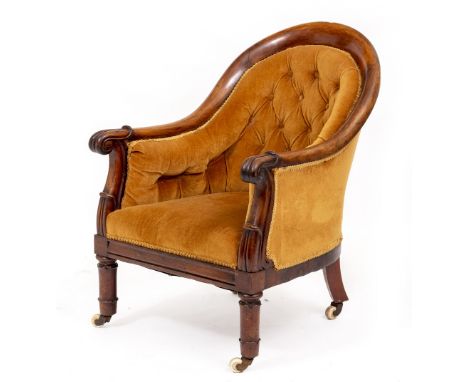 A WILLIAM IV ROSEWOOD ARMCHAIR with a button upholstered arching back, scroll arms, turned front legs with brass and ceramic 