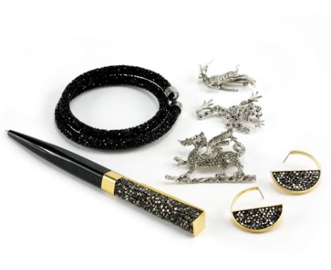 A SWAROVSKI BLACK CRYSTAL BANGLE, a matching pair of earrings, a Swarovski pen, a white metal brooch in the form of a frog an