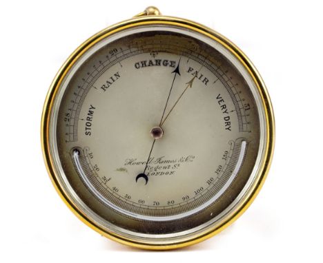 A 19TH CENTURY BRASS CASED ANEROID BAROMETER AND THERMOMETER the silvered dial signed Howell James &amp; Co Regent Street Lon