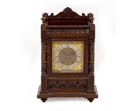 A LATE 19TH / EARLY 20TH CENTURY OAK CASED QUARTER CHIMING MANTLE CLOCK 31.5cm wide x 48cm high
