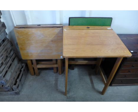 A pair of beech folding school desks and a folding card table 