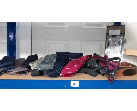 A mixed lot of ties, bow ties and belts.