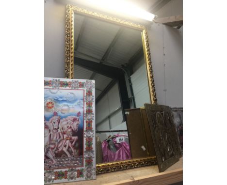 A decorative gilded mirror
