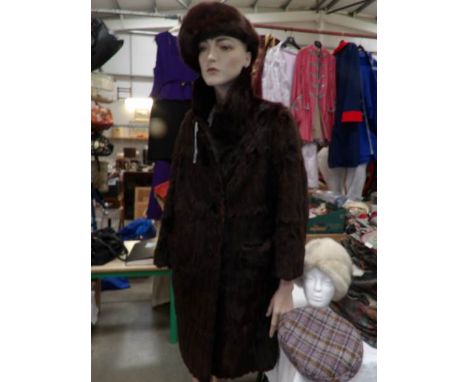 A ladies fur coat, 2 fur hats and a vintage tweed hat.