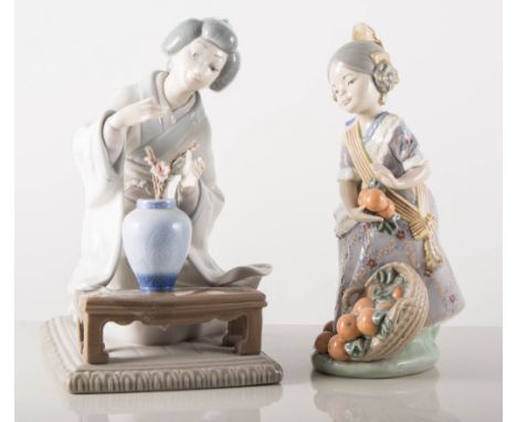 Three Lladro figures, girl with oranges, boy playing with a dog and a Geisha girl with flowers. (3).