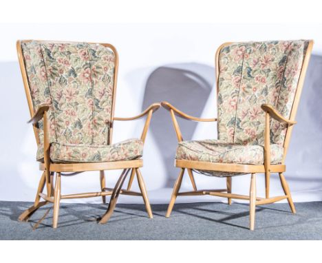 A pair of Ercol pale beech fireside armchairs, (frames only).