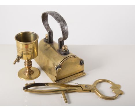 Early Victorian brass trivet, signed J. Evans, 25cm, and other brass trivets, sugar cutters, small hammers, iron, brass ladle