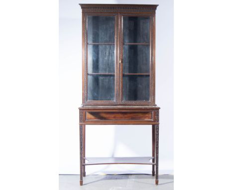 Chippendale revival mahogany display cabinet, dentil cornice, glazed panels, square tapering legs joined by a shelf, througho