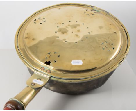 A brass warming pan, oak cased aneroid barometer thermometer with architectural pediment, 11cm dial to barometer, enamel back