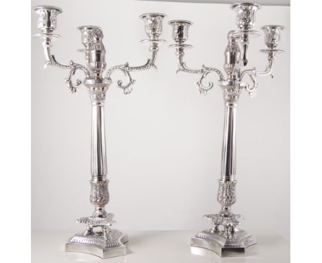 Pair of silver-plated empire style three light candelabra, fluted columns on triform base, 49cm.