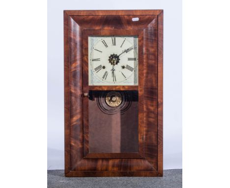 An American walnut cased shelf clock, eight day movement by Waterbury Clock Company.