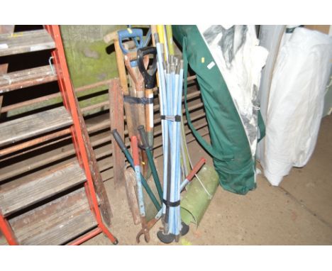 A quantity of long handled gardening tools; and drain rods etc