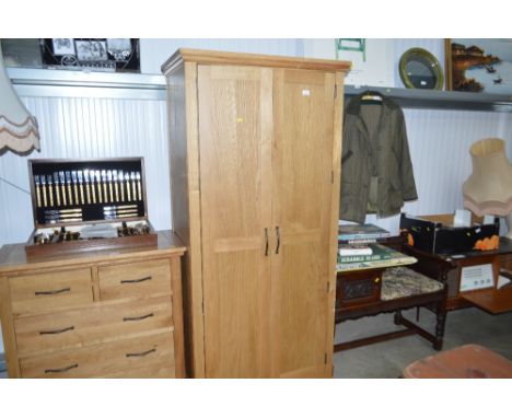 A light oak two door wardrobe