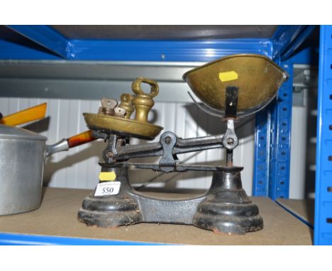 A set of kitchen scales and weights 