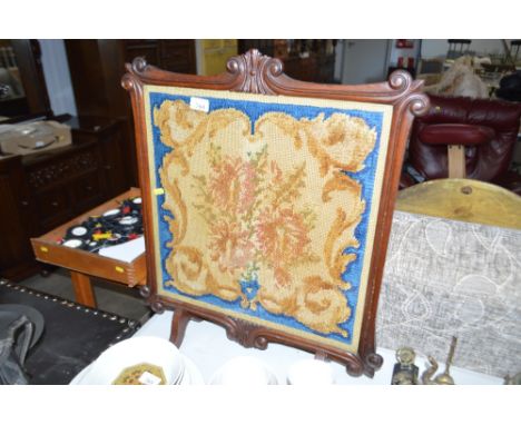 A 19th Century needlework firescreen
