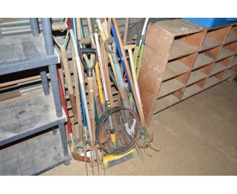 A large quantity of long handled gardening tools etc