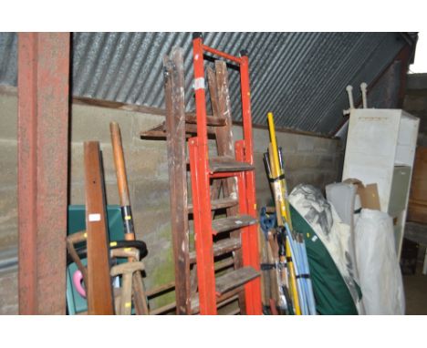 A wooden step ladder; and a wooden and metal step ladder