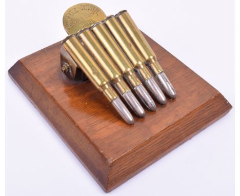Boer War Modder River Souvenir Paper Clip, formed from 5 brass cartridge cases [headstamps all D.M. 1897 K.] with plated bull