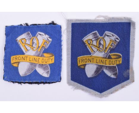 Two Royal Ordnance Factory Overalls Badges, being two variants of the crossed bombs insignia with ROF and “FRONT LINE DUTY” i