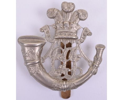 Ceylon Light Infantry Cap Badge, white metal example being Prince of Wales plumes above strung bugle with CLI in script to th