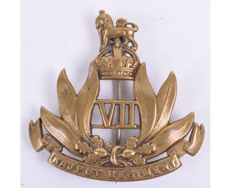 Indian Army 8th Rajput Regiment Pagri Badge, in polished brass with crowned lion in between palm leaf wreath and scroll below