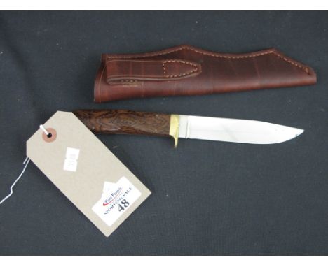 An Allan Wood handmade steel, brass and rosewood hunting knife with single edged blade, brass guard and lanyard eye.  Heavy q