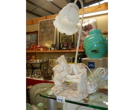 A figural table lamp.