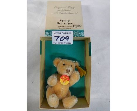 A boxed Steiff smal bear.