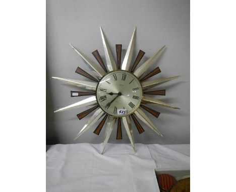 A circa 1960's star shaped wall clock.