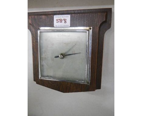A square wall barometer.