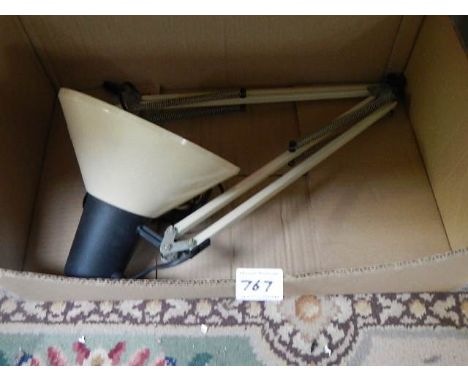 A metal angle poise lamp.