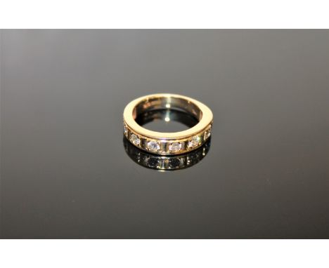 18ct half eternity ring with eight stones 5.2 grams CONDITION REPORT: Ring size J. Each diamond is approximately 0.062 carat.