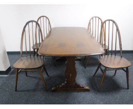 An Ercol refectory table and four chairs 