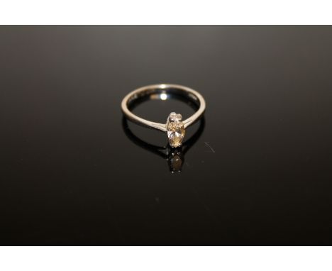 An 18ct white gold diamond solitaire ring, a marquise-cut diamond within a claw setting weighing approximately 0.41 carat, to