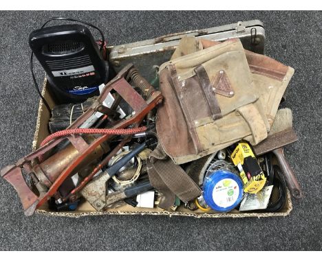 A box of hand tools, vintage foot pump, battery charger, socket set etc 