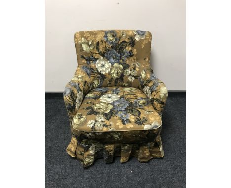 A mid 20th century armchair in button fabric 