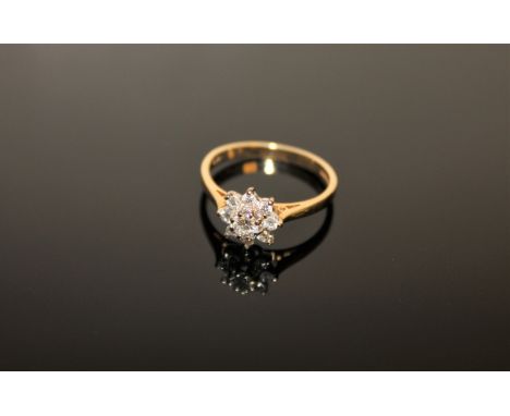 An 18ct gold diamond cluster ring, size N