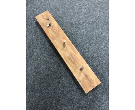 A pine hat and coat rack 