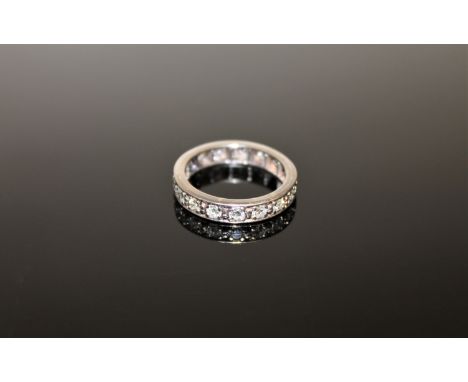 A diamond full eternity ring, set with seventeen diamonds, size L, approximately 0.8ct. CONDITION REPORT: The shank is appare