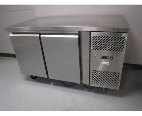 A stainless steel commercial bench fridge 