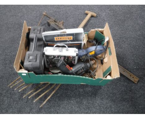 A box of assorted power tools, sash clamp and a hay fork 