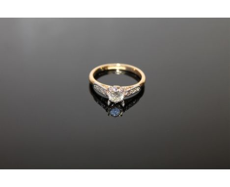 An 18ct gold solitaire diamond ring, approximately 0.5ct, size J, set with diamond shoulders.