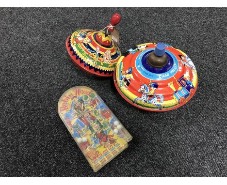 Two vintage Chad Valley spinning tops and a Robin Hood pin ball machine 