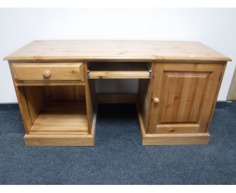 A contemporary pine pedestal desk 