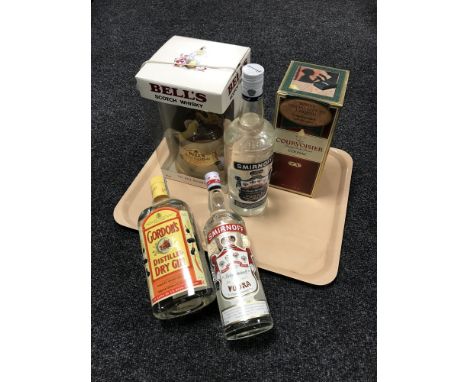 Five bottles of alcohol; Courvoisier Luxe Cognac 70cl, Bell's Scotch Whisky 75cl, Gordon's Dry Gin 1l, Smirnoff Vodka 75cl an
