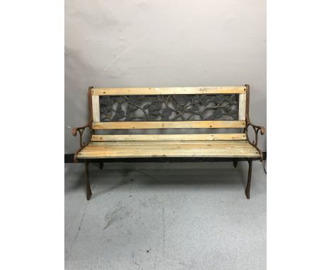 A cast metal and wood garden bench 
