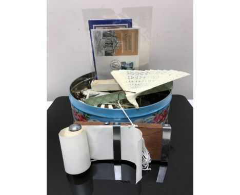 A tin containing costume jewellery, vintage corkscrew, hand fan, first day covers etc CONDITION REPORT: Corkscrew slightly be