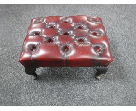 A Chesterfield oxblood button leather footstool 