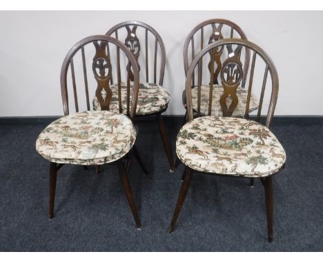 A set of four Ercol dining chairs 
